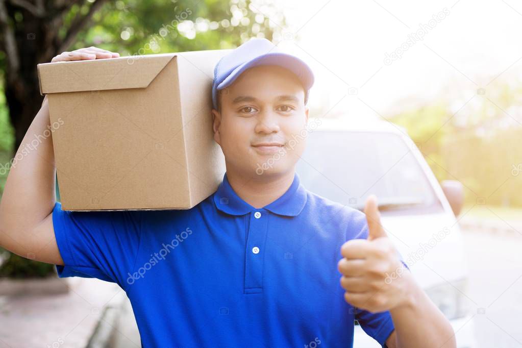 parcel delivery man of a package through a service. consign hand Submission customer accepting a delivery of boxes from delivery man.