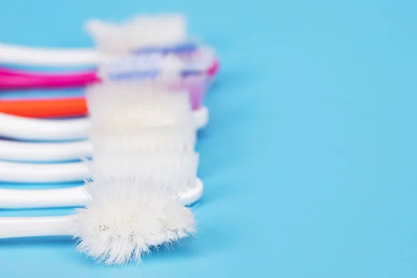Old Toothbrush Used Expired Damaged Variety Colors Blue Background Concept — Stock Photo, Image