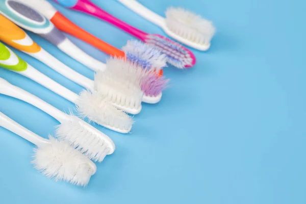 Old Toothbrush Used Expired Damaged Variety Colors Blue Background Concept — Stock Photo, Image