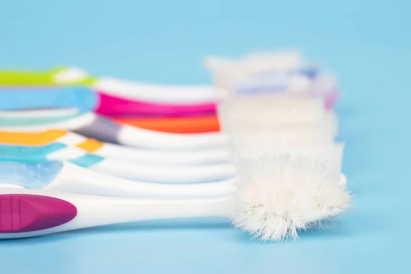 Old Toothbrush Used Expired Damaged Variety Colors Blue Background Concept — Stock Photo, Image