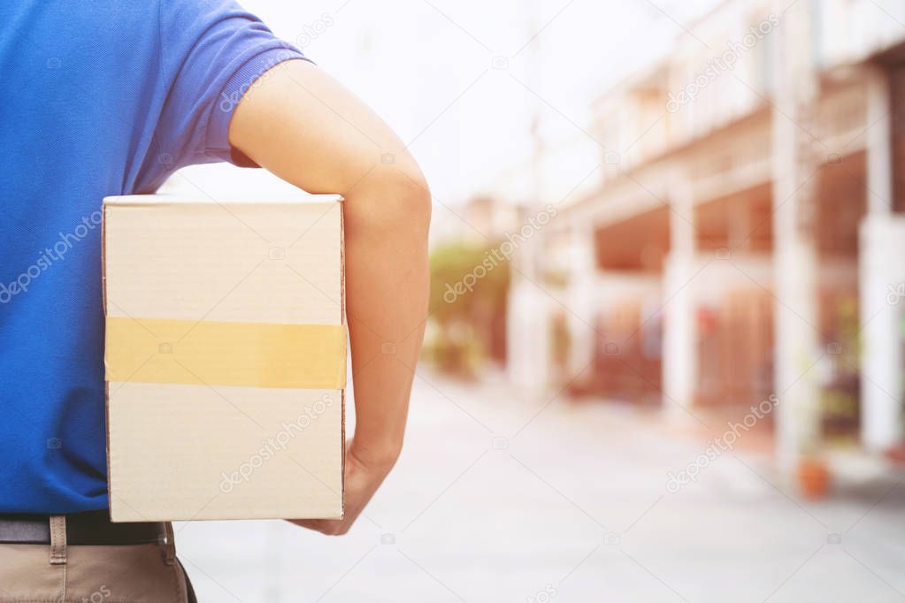 parcel delivery man of a package through a service send to home. consign hand Submission customer accepting a delivery of boxes from delivery man.
