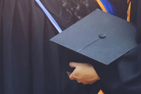 graduation,Student hold hats in hand during commencement success graduates of the university,Concept education congratulation.Graduation Ceremony