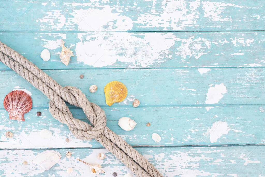 Sand and shells on the wooden floor of the blue