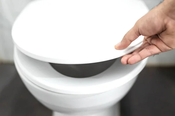 Man Opens Toilet Seat Hand Bathroom — Stock Photo, Image