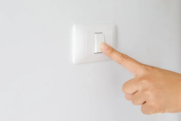 Turn on-off the light switch to save electricity.