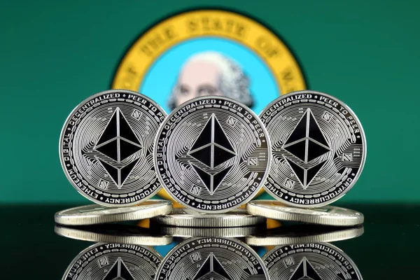 Physical version of Ethereum (ETH) and Washington State Flag. Conceptual image for investors in cryptocurrency, Blockchain Technology, Smart Contracts, Personal Tokens and Initial Coin Offering.