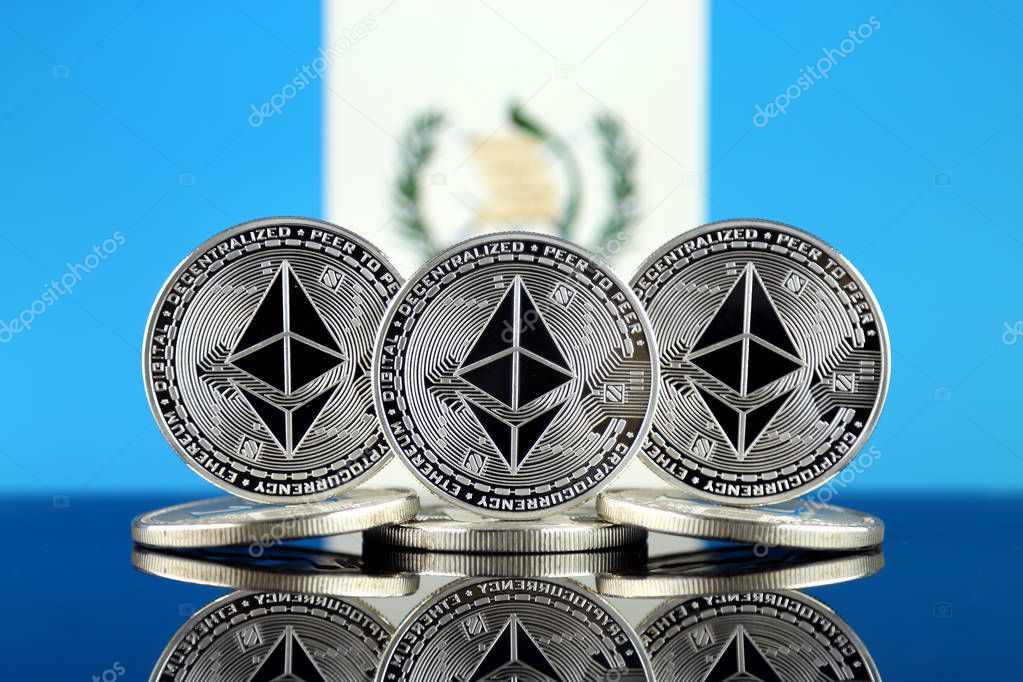 Physical version of Ethereum (ETH) and Guatemala Flag. Conceptual image for investors in cryptocurrency, Blockchain Technology, Smart Contracts, Personal Tokens and Initial Coin Offering.