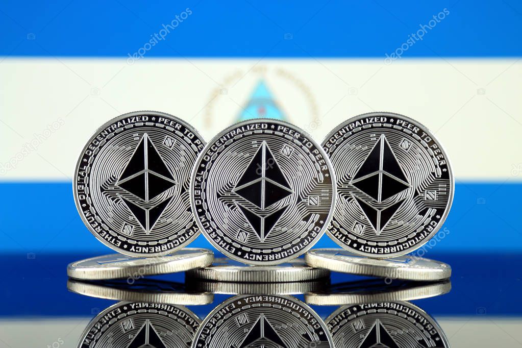 Physical version of Ethereum (ETH) and Nicaragua Flag. Conceptual image for investors in cryptocurrency, Blockchain Technology, Smart Contracts, Personal Tokens and Initial Coin Offering.