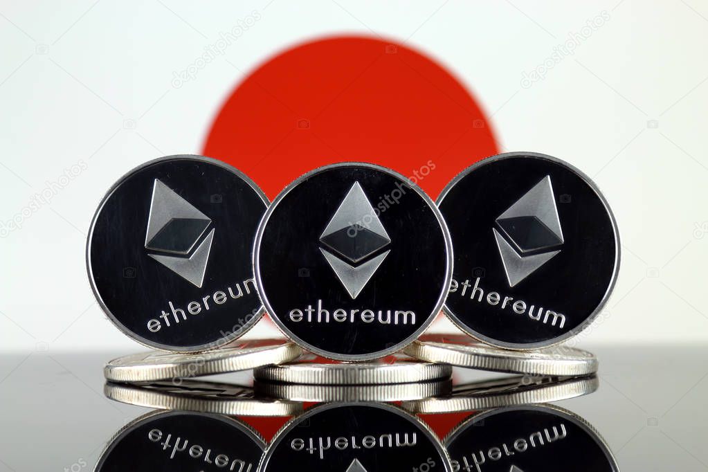 Physical version of Ethereum (ETH) and Japan Flag. Conceptual image for investors in cryptocurrency, Blockchain Technology, Smart Contracts, Personal Tokens and Initial Coin Offering.