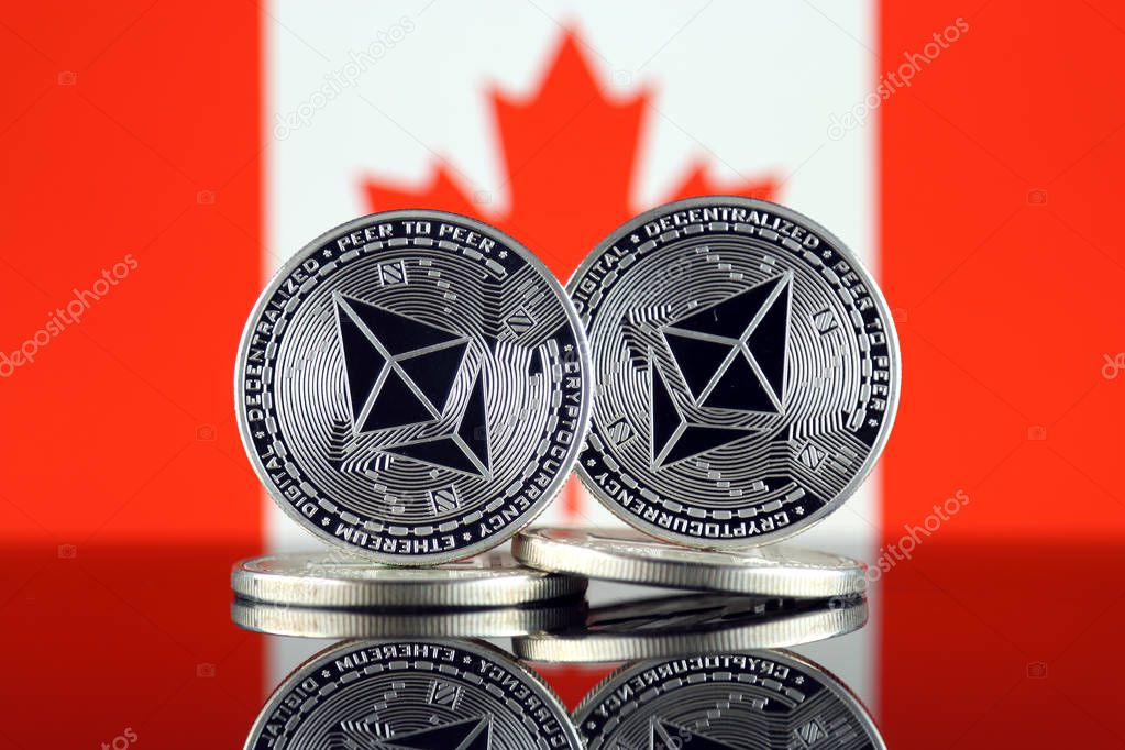 Physical version of Ethereum (ETH) and Canada Flag. Conceptual image for investors in cryptocurrency, Blockchain Technology, Smart Contracts, Personal Tokens and Initial Coin Offering.