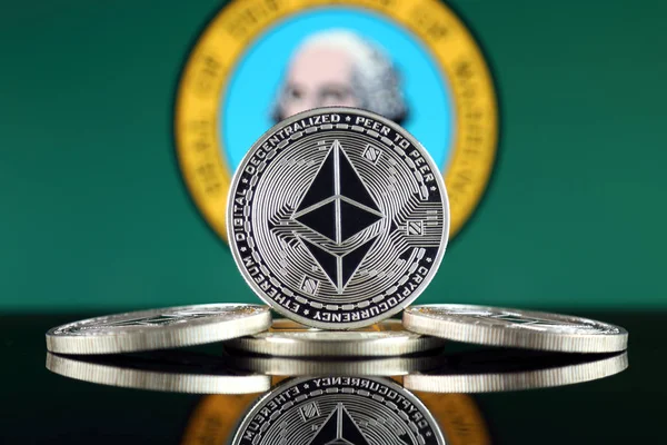 Physical version of Ethereum (ETH) and Washington State Flag. Conceptual image for investors in cryptocurrency, Blockchain Technology, Smart Contracts, Personal Tokens and Initial Coin Offering.