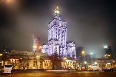 WARSAW, POLAND - NOVEMBER 3, 2018: Palace of Culture and Science (Polish: Palac Kultury i Nauki, abbreviated PKiN) is a notable high-rise building in Warsaw, Poland. Constructed in 1955. Night view. clipart