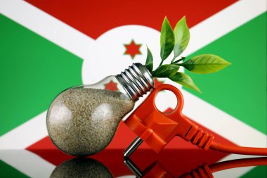 Tak, ampul ve Burundi bayrağı içinde büyüyen bitki. Yeşil eko yenilenebilir enerji kavramı.