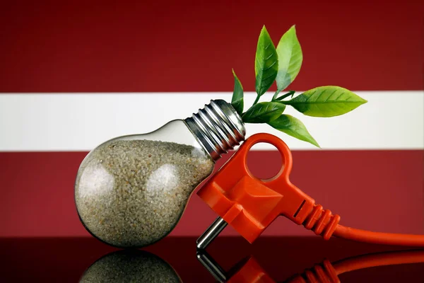 Podłącz Roślin Uprawy Wewnątrz Żarówki Flaga Łotwy Pojęcie Energii Odnawialnej — Zdjęcie stockowe