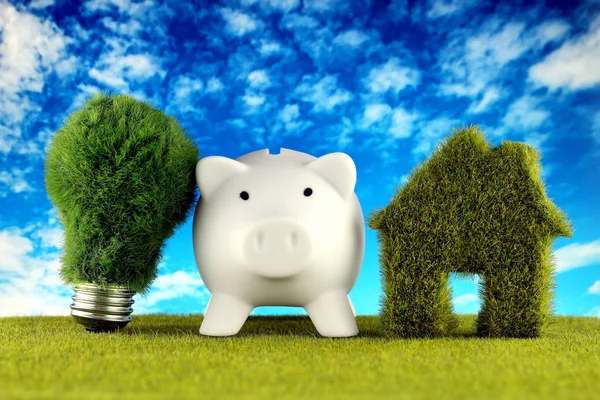 Piggy bank, green eco light bulb and eco house icon concept with grass and blue sky background. Renewable energy. Electricity prices, energy saving in the household.