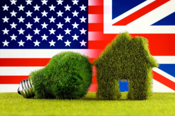 Green eco light bulb, eco house icon, United States and United Kingdom Flag. Renewable energy. Electricity prices, energy saving in the household.