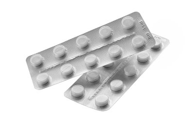 bir blister izole beyaz bir arka plan üzerinde beyaz hap
