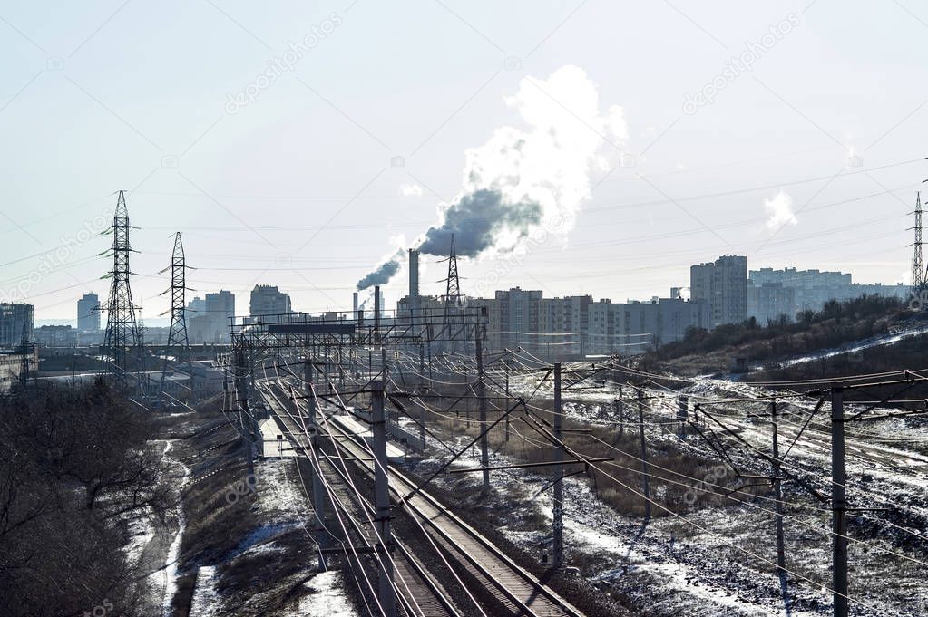 Industrial landscape in the suburbs of the big city. Frosts, contour light. Background.