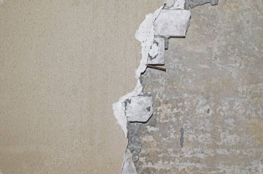 Tuğla duvar kısmen beton levha tabanına sıva temizlenir. Arka plan, doku