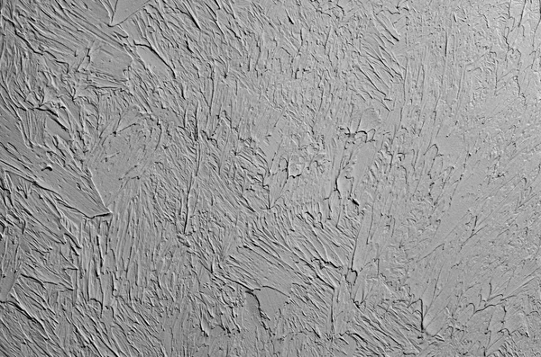 Wallpaper texture of frozen clay on the wall. Black and white background.