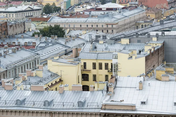 Top view of the restored old part of the city with modern metal roofs.