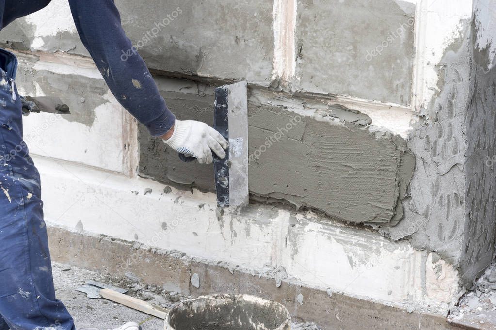 Work aligns with a spatula concrete solution on the Foundation of the building.