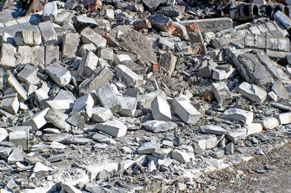 The remains of the Foundation of the building in the form of a pile of white and red bricks.