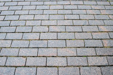 Şehrin eski kesiminde Granit kaldırım. Arka plan doku. Sığ derinlik-in tarla. yukarıdan bir açıyla görüntülemek.