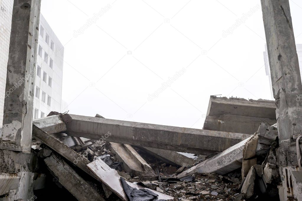 The destroyed big concrete building in a foggy haze. Background. Place to write the text.