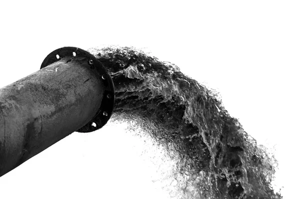 Discharge of water from pipe on a white background. Isolated black and white image. — Stock Photo, Image