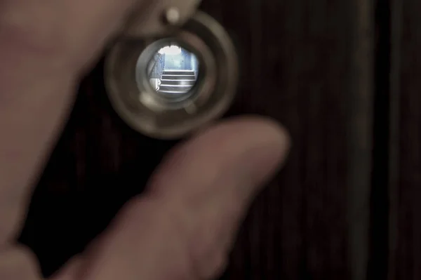 View through the peephole on the landing. Sharpness on the stair step — Stock Photo, Image