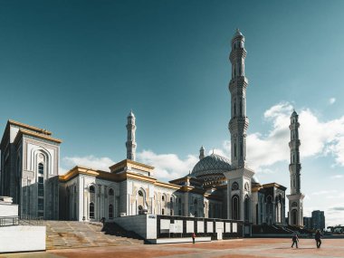 Outside view Mosque Hazrat Sultan in Astana capital of Kazakhstan on a clear day with sun blue sky clipart