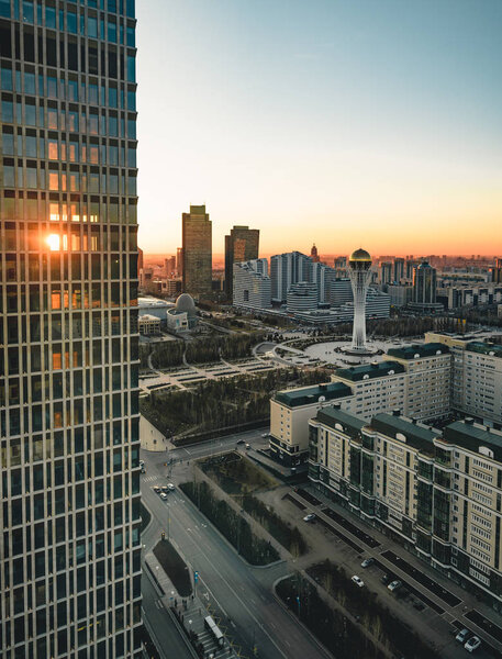 Sunset view towards Bayterek tower and hous of ministries in Astana Kazakhstan on a clear day. Photo taken in Kazakhstan Astana.