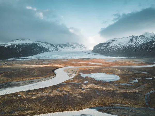 Vatnajokull glacier aerial drone image with street highway and clouds and blue sky. Dramatic winter scene of Vatnajokull National Park, Iceland, Europe. Beauty of nature concept background. — Stock Photo, Image