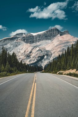 Empty Icefields Parkway Street with Mountain Panorama in Banff National Park. clipart