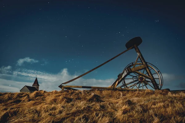 Small church in Iceland in Snaefellsnes at night with moon stars blue sky and clouds. — Stock Photo, Image