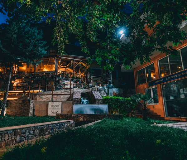 stock image Spili Crete, Greece August 2018: Night view on a park in the village of Spili with tavernas on Crete island.