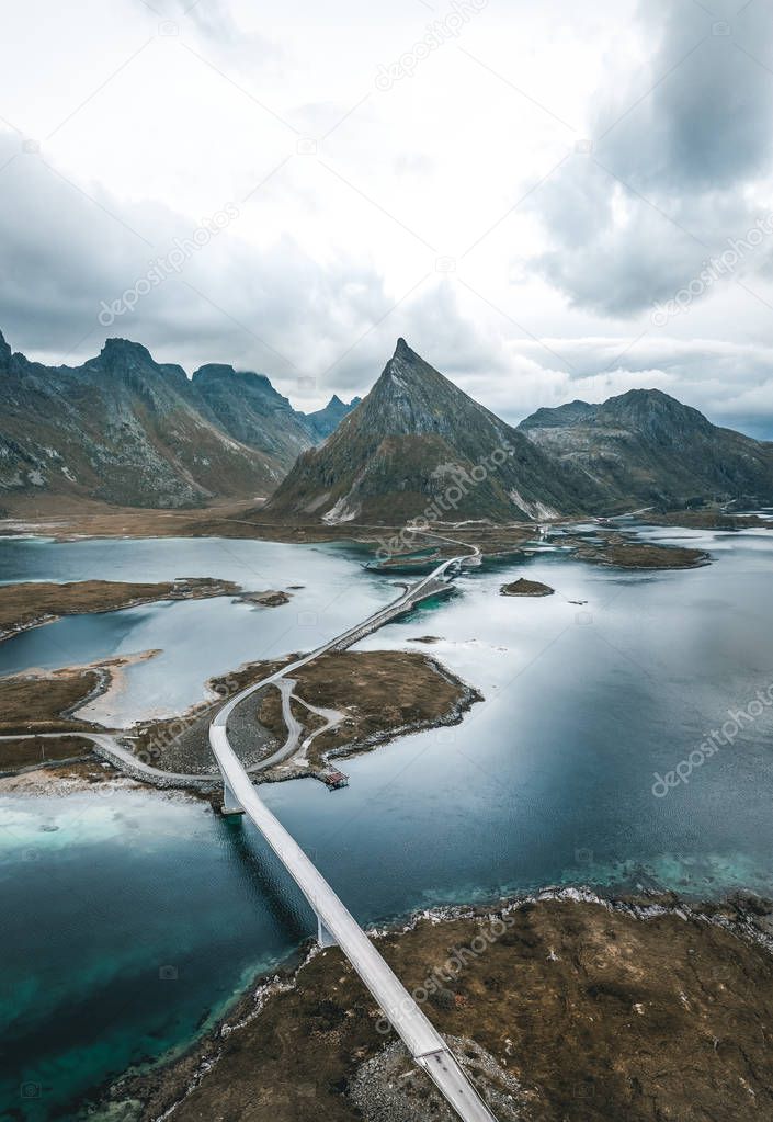 The stunning Fredvang bridges in Lofoten Islands, Norway seen from a drone aerial. They connect the fishing village of Fredvang on Moskenes ya island with the neighboring island of Flakstad ya.