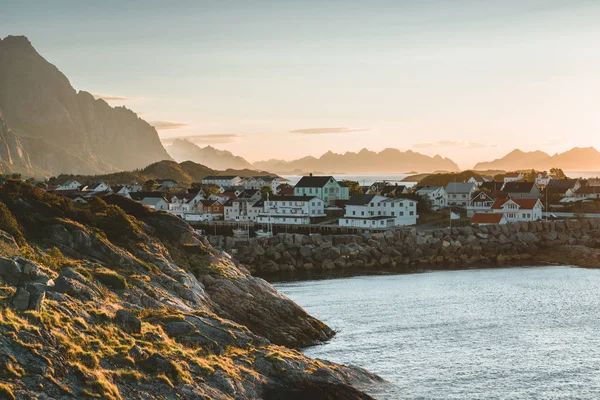 Sunrise and Sunset at Henningsvaer, fishing village located on several small islands in the Lofoten archipelago, Norway over a blue sky with clouds. — Stock Photo, Image