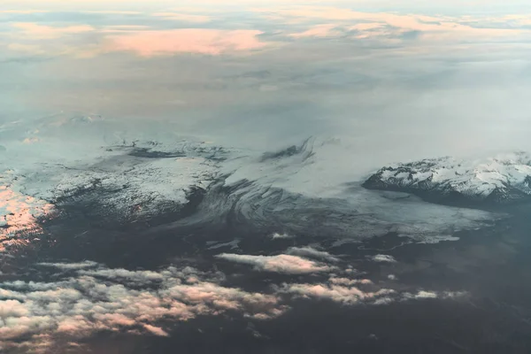 Aerial view of sunrise in winter nature landscape in north Iceland with glaciers in background. Snow Capped mountains and Glacier. — Stock Photo, Image