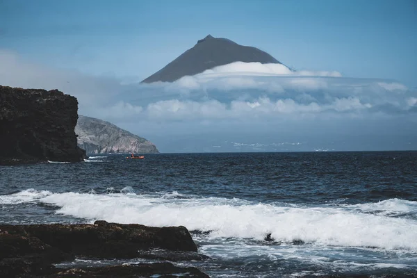 Mount Pico volcano western slope viewed from ocean with summit in clouds, seen from Faial Island in Azores, Portugal. — Stock Photo, Image