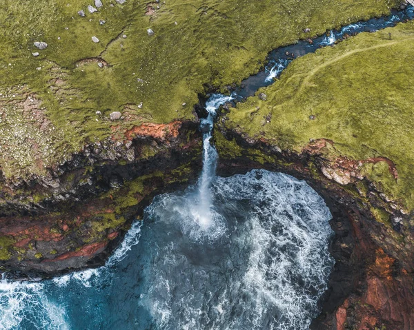 Aerial drone panorama of Mulafossur waterfall, Vagar, Faroe Islands, Denmark. Rough see in the north atlantic ocean. Lush greens during summer. — Stock Photo, Image