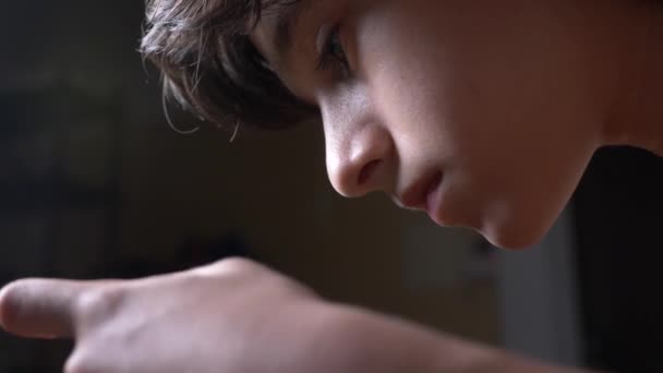 Cute Teenager Boy In His Room At Night Lying On The Bed Using A Smartphone He Reads The Text On His Phone Eyes Close Up 4k