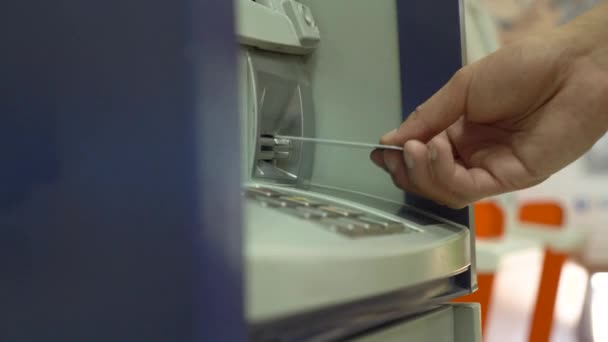 Human hand applies a credit card in pos terminal. Detail of the card. Credit card machine for money transaction. Close up. Payment technology — Stock Video