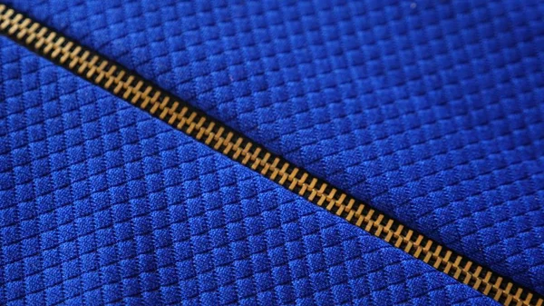 Tessuto come sfondo. tessuto strutturato blu, chiusura con zip — Foto Stock