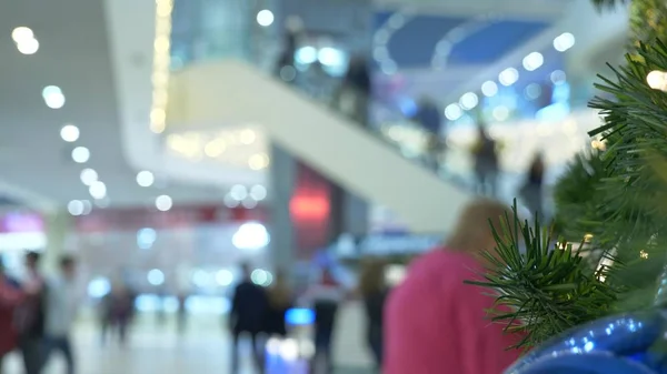 concept of holiday shopping. Blur the hall in the shopping center with Christmas decorations.