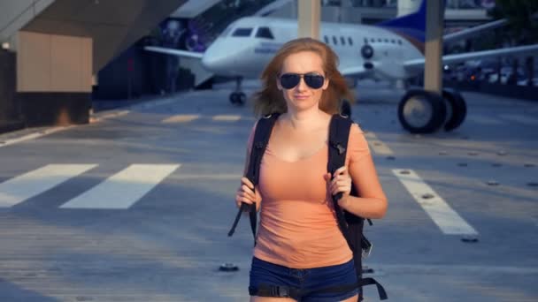 Concept Tourism Woman Tourist Sunglasses Backpack Her Back Goes Airport — Stock Video