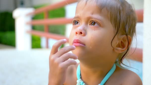 Closeup, portrait Little cute Asian girl crying with tears on her face. — Stock Video