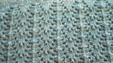 Simli ile mavi Triko kökenli. yakın çekim. örme dantel kumaş dokusuna.