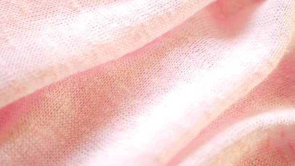 Pozadí z jemně růžové pletené. detail. pletená textilie textura